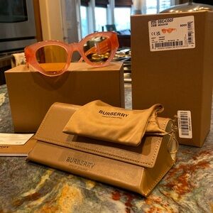 Authentic Burberry sunglasses in orange jelly. Called Meadow.